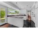 Modern kitchen with white cabinets, sleek countertops, and a view to the outdoors at 4596 E Calle Ventura --, Phoenix, AZ 85018