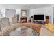 Cozy living room with a fireplace, stylish seating, and a large flat-screen TV at 4596 E Calle Ventura --, Phoenix, AZ 85018