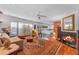 Spacious living room boasts hardwood floors, a fireplace, and large windows, perfect for entertaining or relaxing at 4596 E Calle Ventura --, Phoenix, AZ 85018