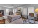Spacious bedroom with large windows, neutral carpet, ceiling fan, and lots of natural light at 4596 E Calle Ventura --, Phoenix, AZ 85018