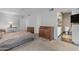 Spacious bedroom with large windows and adjacent bath provides neutral carpet, ceiling fan, and lots of natural light at 4596 E Calle Ventura --, Phoenix, AZ 85018