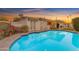 A beautiful pool with patio is surrounded by lush plants and vegetation in the backyard at 4596 E Calle Ventura --, Phoenix, AZ 85018
