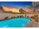 The backyard boasts a refreshing pool and a lush landscape, ideal for relaxation and entertainment at 4596 E Calle Ventura --, Phoenix, AZ 85018