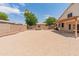 Backyard with low-maintenance landscaping, secure fencing and a covered patio with an adjacent storage shed at 4746 W Taro Dr, Glendale, AZ 85308