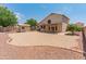 Large backyard features low-maintenance landscaping, a storage shed, and a covered patio for outdoor enjoyment at 4746 W Taro Dr, Glendale, AZ 85308