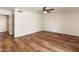 Simple, spacious bedroom featuring hardwood floors and a ceiling fan at 4746 W Taro Dr, Glendale, AZ 85308
