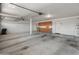 Spacious garage featuring built-in cabinets, water heater, and ample room for storage and parking at 4746 W Taro Dr, Glendale, AZ 85308