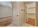 Hallway with doorway views into a bedroom and a walk-in closet at 4746 W Taro Dr, Glendale, AZ 85308