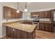 Well-equipped kitchen with granite countertops, stainless steel appliances, and ample wood cabinetry at 4746 W Taro Dr, Glendale, AZ 85308