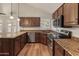Beautiful kitchen with granite countertops and stainless steel appliances at 4746 W Taro Dr, Glendale, AZ 85308