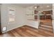 Bright living room with hardwood floors and stairs leading to the kitchen area at 4746 W Taro Dr, Glendale, AZ 85308