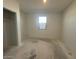 A bright bedroom with a window at 47692 W Moeller Rd, Maricopa, AZ 85139
