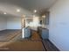 Spacious open-concept kitchen with gray cabinets, center island, and hardwood style floors at 47692 W Moeller Rd, Maricopa, AZ 85139