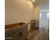 Kitchen featuring stylish cabinets, modern flooring, and abundant natural light at 47692 W Moeller Rd, Maricopa, AZ 85139