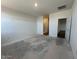 Bright main bedroom featuring a walk-in closet and ensuite bath, ready for finishing touches at 47692 W Moeller Rd, Maricopa, AZ 85139