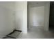 Unfinished bathroom features a built-in shower caddy and fixtures, awaiting final touches at 47719 W Moeller Rd, Maricopa, AZ 85139