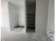 Unfinished bathroom includes built in shower storage and a closet awaiting finishing touches at 47719 W Moeller Rd, Maricopa, AZ 85139