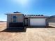 New construction home featuring a two-car garage and a gray stucco exterior under a clear blue sky at 47719 W Moeller Rd, Maricopa, AZ 85139