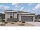 Beautiful single-story home features a two-car garage and professionally landscaped front yard at 47719 W Moeller Rd, Maricopa, AZ 85139