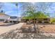 Charming single-story home with a well-maintained front yard and a RV trailer parked in the driveway at 4804 S Elm St, Tempe, AZ 85282