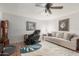 Spacious living room offers comfortable seating, ceiling fan, and stylish decor at 4804 S Elm St, Tempe, AZ 85282