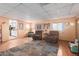 Spacious living room with hardwood floors, comfortable seating, and natural light perfect for relaxation at 4804 S Elm St, Tempe, AZ 85282