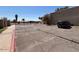 A view of a parking lot with designated spaces, landscaping, and a gated entrance at 5002 N 41St Ave, Phoenix, AZ 85019