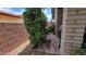 Inviting backyard nook features a bench, tiled patio, and lush greenery, perfect for relaxation at 650 N 65Th Way, Mesa, AZ 85205