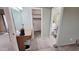 Bathroom view featuring vanity and doorways to closet and toilet and shower at 650 N 65Th Way, Mesa, AZ 85205