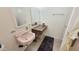 Bathroom featuring a pink sink and vanity with tile flooring at 650 N 65Th Way, Mesa, AZ 85205