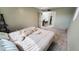 Spacious bedroom featuring neutral walls, carpeted flooring, and open doorways at 650 N 65Th Way, Mesa, AZ 85205