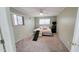 Cozy bedroom with plush carpeting, ceiling fan, and a window providing natural light at 650 N 65Th Way, Mesa, AZ 85205
