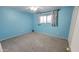 Cozy bedroom with blue walls, neutral carpet and good natural light at 650 N 65Th Way, Mesa, AZ 85205