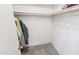 Walk-in closet with shelves and hanging rods, providing ample storage space at 650 N 65Th Way, Mesa, AZ 85205