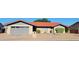 Charming single-story home with a well-maintained front yard and appealing brick facade at 650 N 65Th Way, Mesa, AZ 85205
