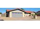 Single Gathering home featuring a two car garage with a brick exterior and desert landscaping at 650 N 65Th Way, Mesa, AZ 85205
