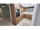 Functional kitchen featuring light countertops, wood cabinetry, and essential appliances at 650 N 65Th Way, Mesa, AZ 85205