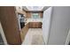 Functional kitchen featuring light countertops, wood cabinetry, and essential appliances at 650 N 65Th Way, Mesa, AZ 85205