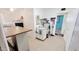 Bright laundry room with tile floors, washer, dryer, sink, and access to another room at 650 N 65Th Way, Mesa, AZ 85205