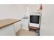 Bright laundry area featuring a modern washer and dryer, plus tiled floor and shelves at 650 N 65Th Way, Mesa, AZ 85205