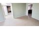 An open-concept room with tile flooring, bright walls, and an adjacent dining area at 650 N 65Th Way, Mesa, AZ 85205