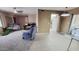 Open living space featuring tile and carpet flooring, and comfortable furniture at 650 N 65Th Way, Mesa, AZ 85205
