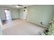 Open-concept living room featuring tile floors, neutral walls, and a ceiling fan at 650 N 65Th Way, Mesa, AZ 85205