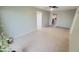 Open living room featuring neutral colored walls, tile flooring, and a ceiling fan at 650 N 65Th Way, Mesa, AZ 85205