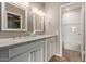 Bathroom with a double vanity, neutral walls, and an adjacent shower/tub at 750 E Northern E Ave # 2145, Phoenix, AZ 85020