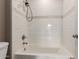 Bathroom view showcasing a white bathtub with a shower head and white tile at 750 E Northern E Ave # 2145, Phoenix, AZ 85020