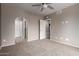 Bedroom showcasing neutral paint and carpeting, along with an ensuite bathroom at 750 E Northern E Ave # 2145, Phoenix, AZ 85020
