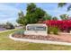 Community sign 'Las Brisas' amidst vibrant landscaping, adding charm to the entrance of the community at 750 E Northern E Ave # 2145, Phoenix, AZ 85020