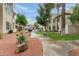 Scenic view of a lush courtyard, featuring vibrant landscaping, pathways, and inviting outdoor seating at the condos at 750 E Northern E Ave # 2145, Phoenix, AZ 85020