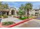 Elegant building entrance with lush landscaping, a charming fountain, and welcoming pathways surrounded by greenery at 750 E Northern E Ave # 2145, Phoenix, AZ 85020